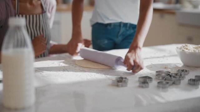 Homemade cookies, woman and teen girl rolling dough for pie or cake on table. Family dinner in holidays, housewife teaching her daughter to cook and bake traditional delicious bakery and sweet