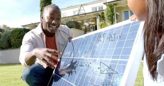Man kneeling holding panel pointing at cells, sparking math overlays, child touching for solar tech
