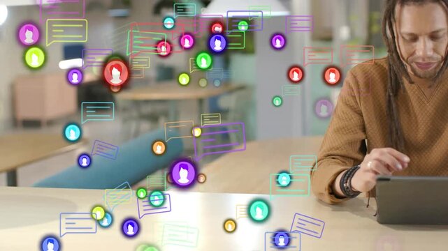 Colorful icons appearing and clustering leading man right leaning and tapping tablet for tech work