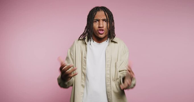 Young man shares thoughts on life and emotions in a fun way in a studio with simple background and lighting
