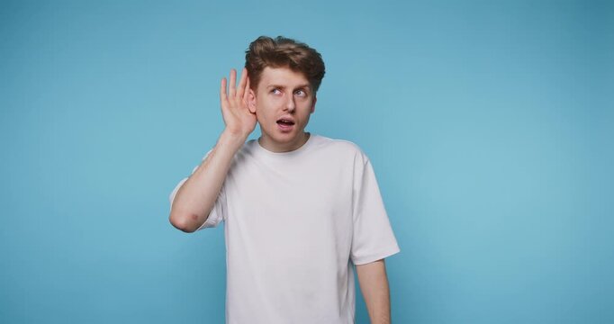 Person listens intently while showing different facial expressions in front of a blue background