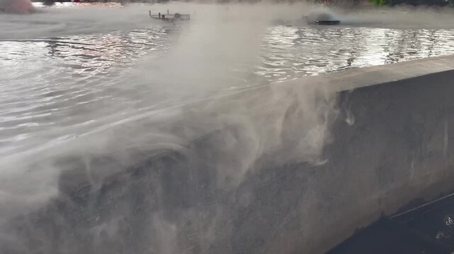 Mini fountain with smoke dry ice decorated in public mall, stock footage