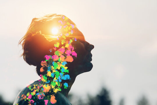 Transgender bisexual man queer with rising sun and rainbow colors inside his head. Pride and freedom love concept