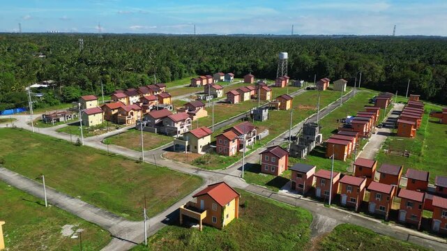 Push-in shot approaching a house layers from above at Camella Homes Alfonso Cavite Philippines