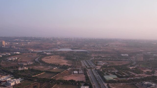 Aerial shot of Islamabad&rsquo;s suburban layout with roads, open plots, and scattered buildings, Islamabad, Pakistan