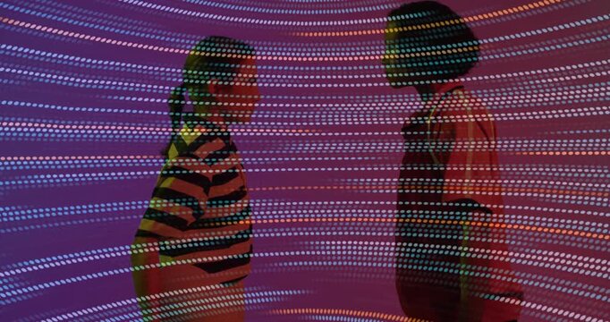 Art gallery visitors walking into cylindrical LED install pausing, spiraling dots energizing mood