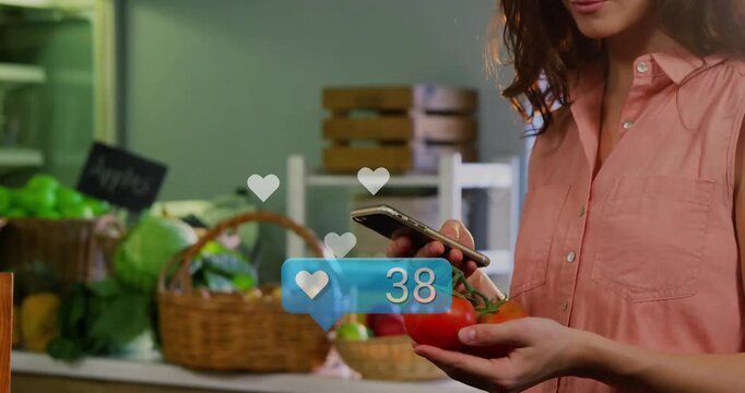 Creator grabbing phone and tracking rising heart icons around tomatoes for social media feedback