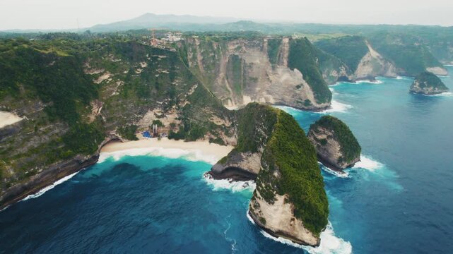 Drone flying over Kelingking Beach in Nusa Penida, Bali