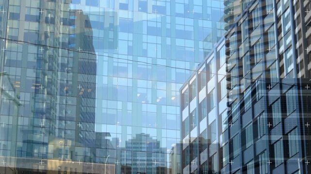 Animation of squares over low angle view of building against clear sky