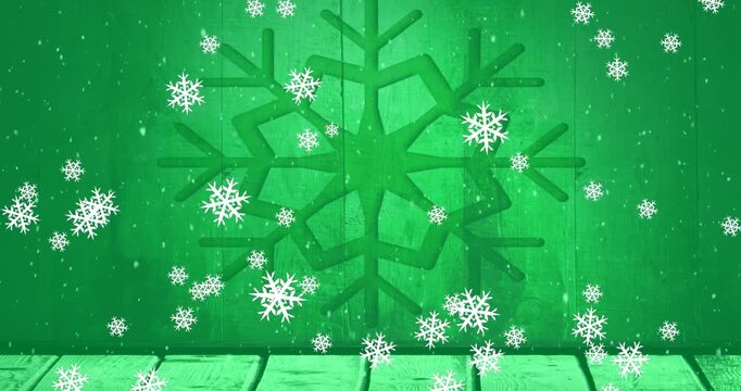 Animation of snowflakes falling over wooden plank against snowflake icon on green background