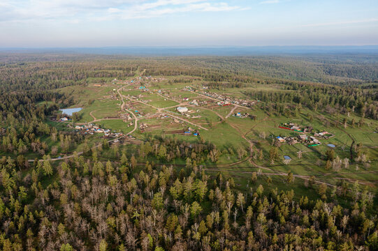 Southern Urals in spring: mountainous Bashkir village of Kyzlar-Birgan. Aerial view.