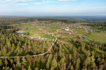 Obraz premium Southern Urals in spring: mountainous Bashkir village of Kyzlar-Birgan. Aerial view.