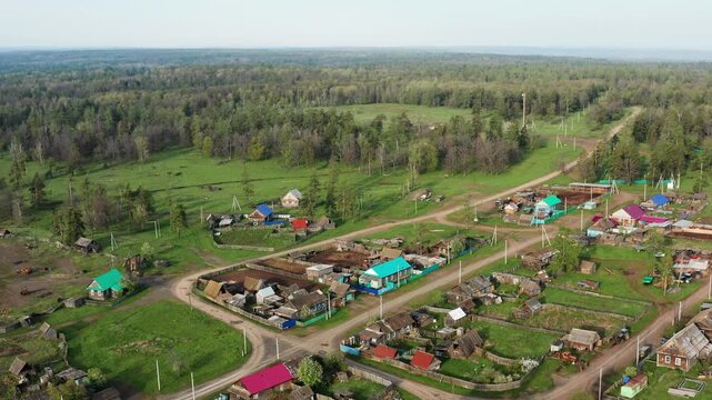 Southern Urals in spring: mountainous Bashkir village of Kyzlar-Birgan. Aerial view.