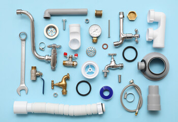 Fototapeta premium Composition with plumber's items on blue background