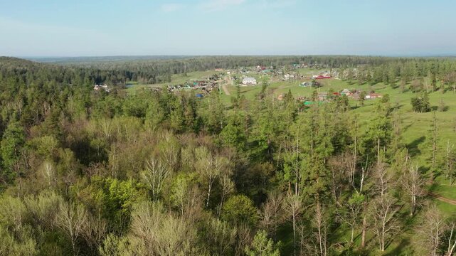 Southern Urals in spring: mountainous Bashkir village of Kyzlar-Birgan. Aerial view.