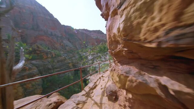 Scenic footage from the popular Canyon Overlook Trail in Zion National Park, Utah. This short, family-friendly hike leads to a stunning viewpoint above the Zion-Mt. Carmel Tunnel, showcasing the majes