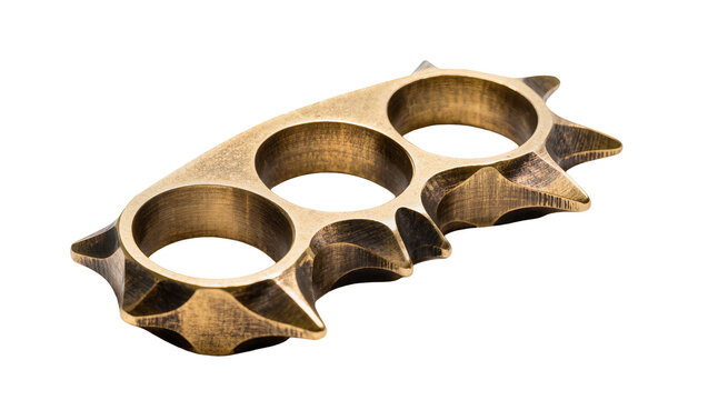 Antique brass knuckles featuring three finger holes jagged edges, and a weathered texture