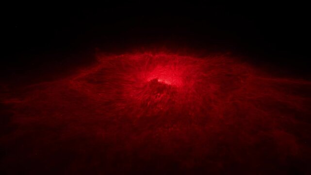 Dramatic red nebula in deep space against the vast darkness of cosmos