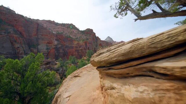 Panoramic view footage of the famous Canyon Overlook Trail in Zion National Park, Utah. This popular, short, one-mile round trip hike offers stunning views of the main canyon and features eroded, cros