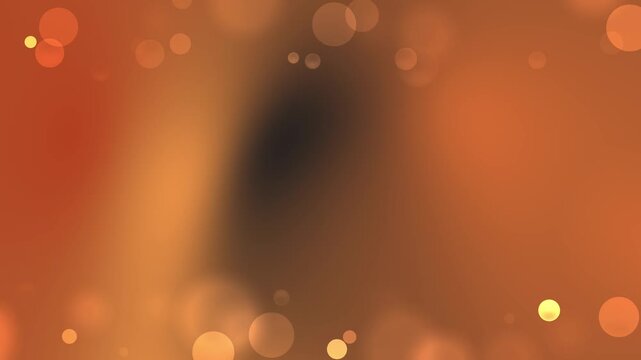 Abstract orange background with bokeh light effects