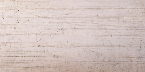Obraz premium Multilayered texture of beige-pink marble with natural veins and patterns. Close-up of sedimentary rocks. Geological and mineralogical basis for interior design concepts. Banner format.