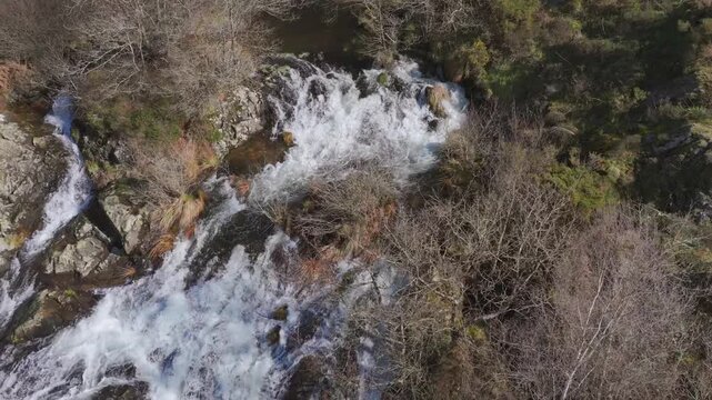 Above View Of Waterfall Of Furelos River In Toques, Melide, A Coruna, Galicia, Spain. Aerial Pullback Shot