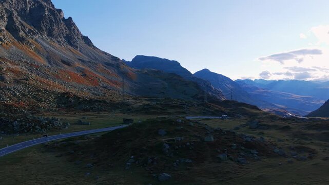 Panoramic road of the Julier Pass surrounded by majestic mountains with autumn colors in the Swiss Alps, Switzerland
