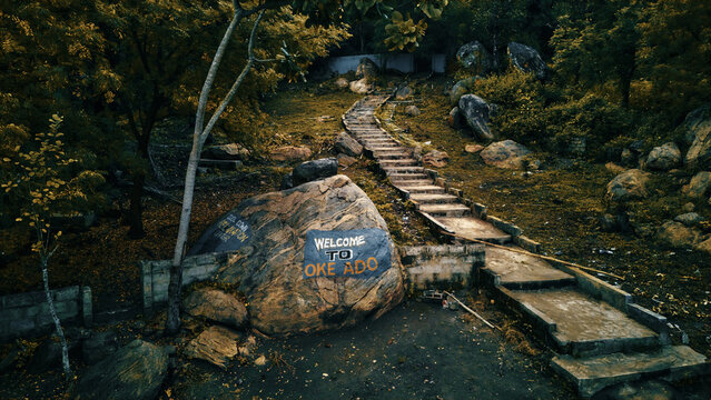 Aerial view of Oke-Ado mountain path, with the big stone that says "WELCOME TO OKE ADO", Oyo, Oyo, Nigeria.