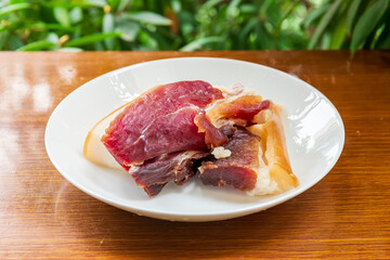 Fototapeta premium The cured meat on the plate