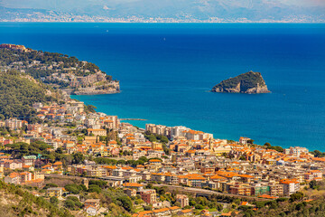 Naklejka premium Aerial panoramic view of the coast of Spotorno, Bergeggi Island, Torre del Mare, Liguria, province of Savona, Italy. Riviera dei Fiori. Western Riviera. Ligurian Sea