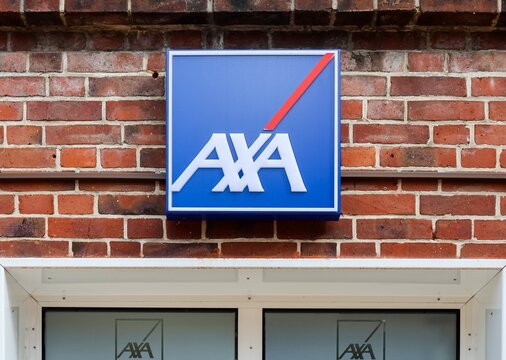 Neumuenster, Germany - 29. March 2026: AXA logo sign on a business building wall