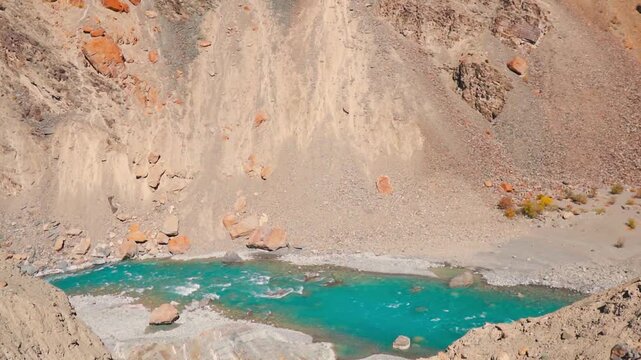 Blue Tsarap chu river flowing in the mountain valley of Zanskar, Ladakh, India. Rocky dry mountains during autumn season in Indian Himalayas. Natural background. Travel and trekking adventure concept