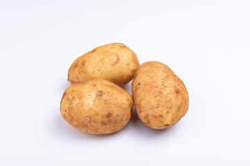 Fototapeta premium Fresh potatoes on a white background