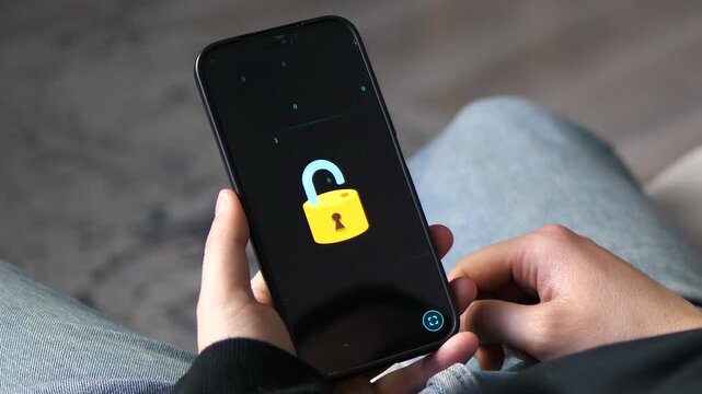 Conceptual animation of a digital padlock unlocking on a smartphone screen with fast-flowing binary code. Perfect for cybersecurity, data protection, and privacy-themed projects. High-quality 4K