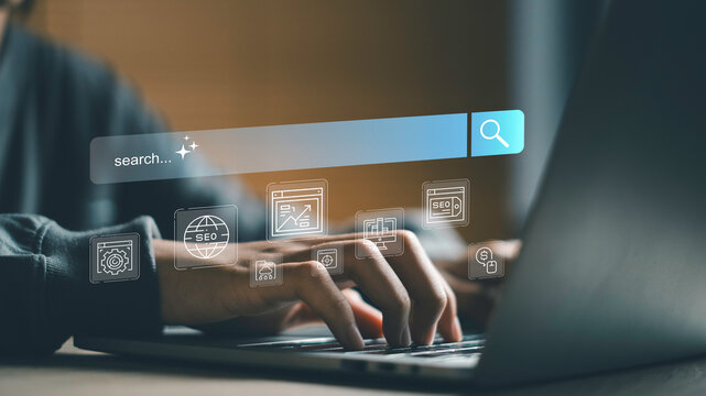 SEO search interface with user typing on laptop, Keyword research, website optimization and digital marketing analytics. Search engine strategy driving traffic, ranking and online business growth.