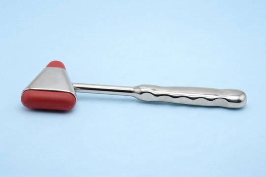 Neurological reflex hammer for medical diagnostic examination on blue background