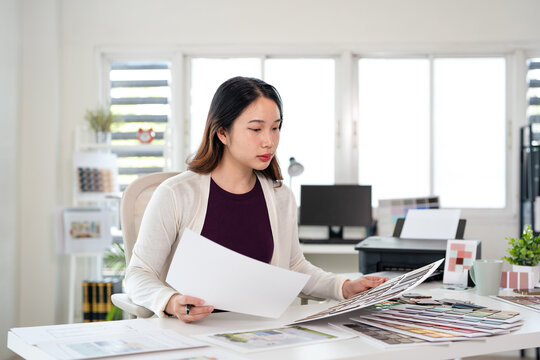 Architect or interior designers are finalizing the design of interiors by selecting materials and colors for finishing to design rooms to present to clients.