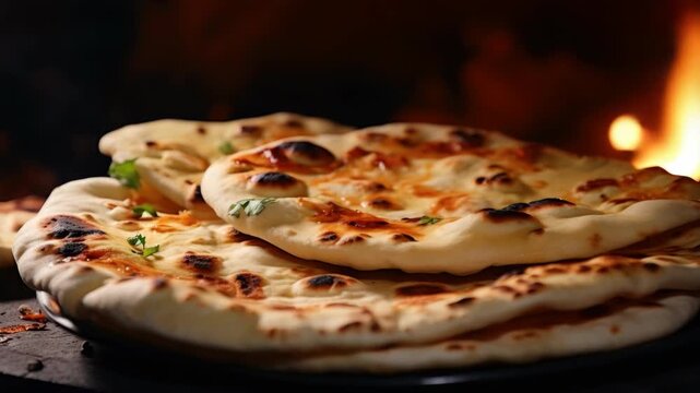 Homemade Indian pizza with naan flatbread, cheese, and spices. Garnished with fresh herbs for a burst of flavor.