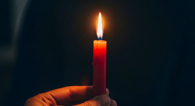 Holy week christianity a lit candle symbolizing faith hope and remembrance during passiontide observance
