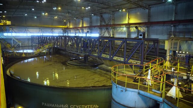 Large Radial Thickener Tank Inside a Coal Processing Plant. Industrial Mineral Separation Equipment in an Ore Enrichment Facility.