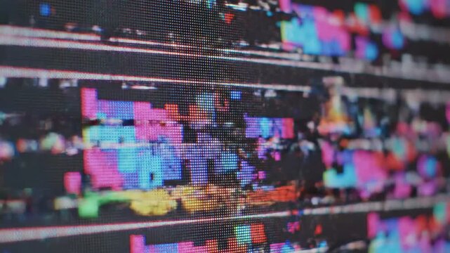 This shows a distorted and glitchy screen with colorful pixels and technical difficulties, conveying a sense of malfunction and disruption in a digital system.