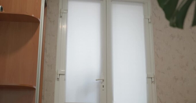 Man and child open doors returning home after walk in winter. 4K 10-bit