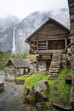 Off grid traditional stone houses "Rustici" rest in the rainy mountain village of Sonlerto, ideal for travel themes