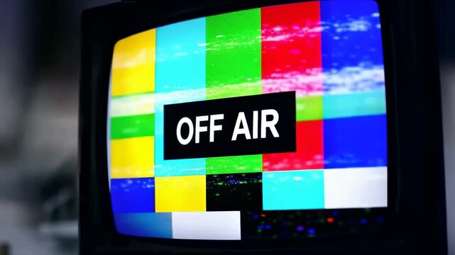 This captures a static television screen with a prominent Off Air message, indicating technical difficulties or a loss of signal. The screen displays a colorful array of squares and rectangles, with a