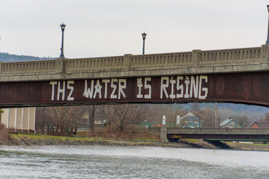 Graffiti on Bridge in Ithaca "The Water Is Rising"