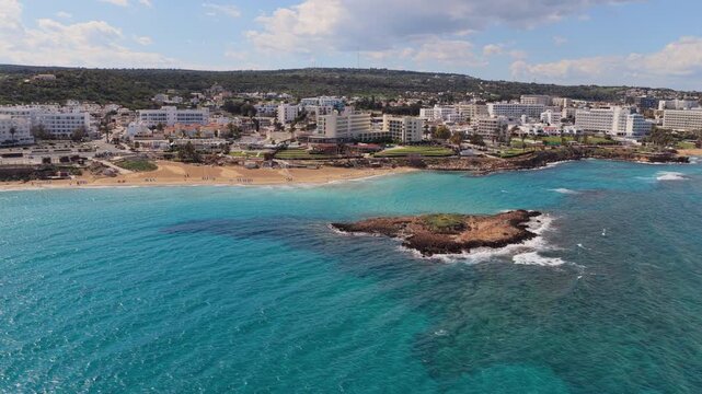 Aerial drone view of Fig Tree beach and landscaped promenade along the coast of Protaras, Cyprus