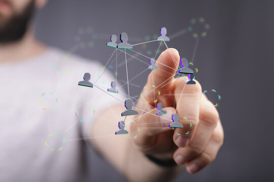 Person interacting with a digital network, representing concepts of communication, technology, and connection in a glob