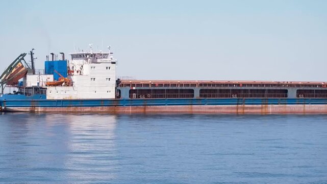 cargo ship in the port A container ship is a large cargo vessel designed to transport goods in standardized containers across oceans.

