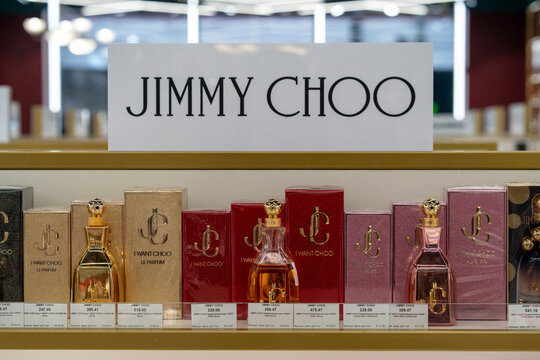 Jimmy Choo perfume on store shelves. Jimmy Choo sign and fragrance products on the Jimmy Choo counter at a beauty store. Minsk, Belarus - December 16, 2025