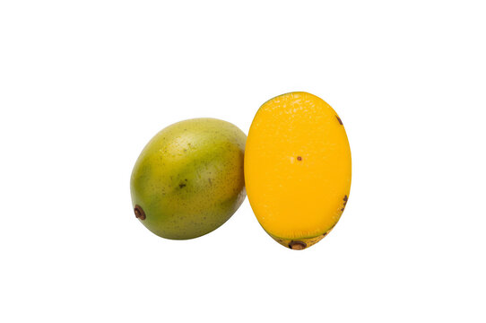 Jocote tropical fruit with a green and cut yellow half